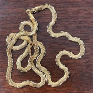 Herringbone gold tone long necklace